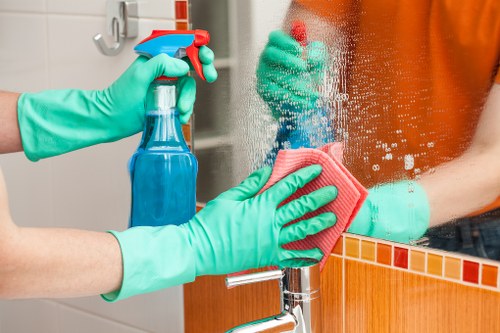 Machine scrubbing hard floors in a Lambeth property