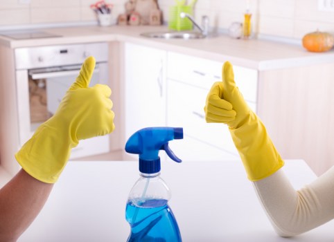 Professional carpet cleaner in Lambeth deep cleaning a living room carpet