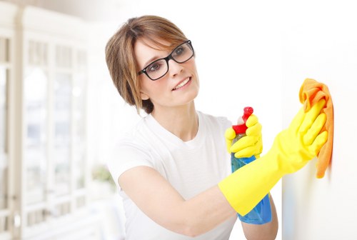 Domestic cleaner tidying a Lambeth kitchen