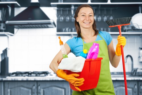 Cleaner wearing PPE while following workplace safety measures